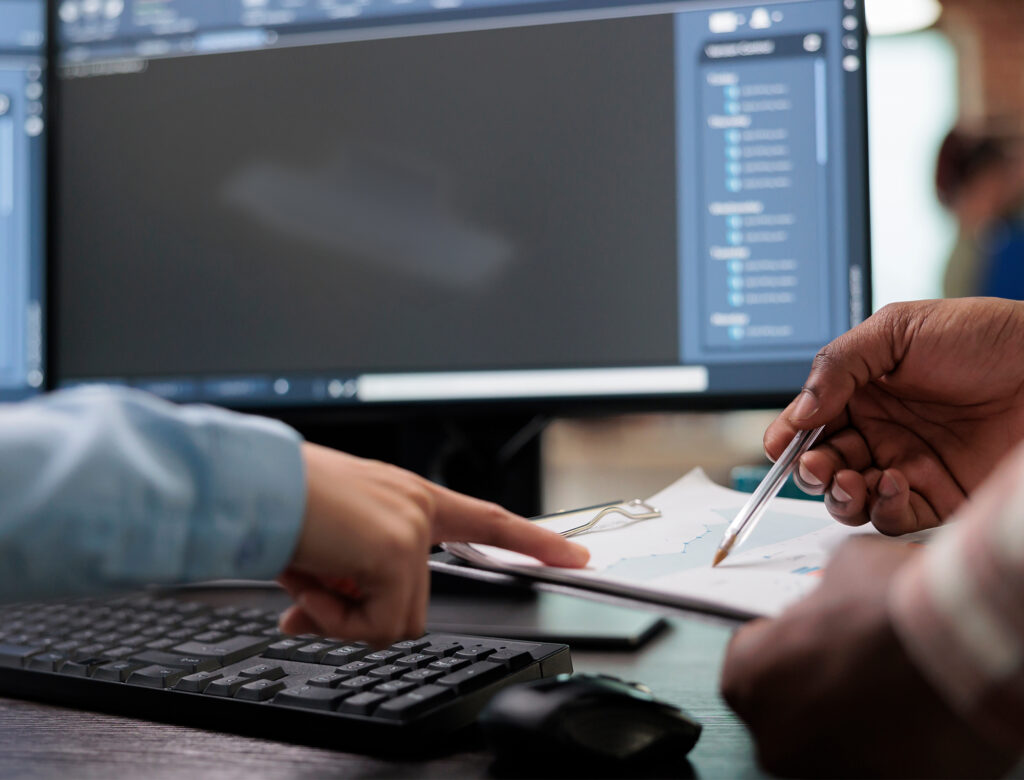 Engineering reviewing digital product model on a computer