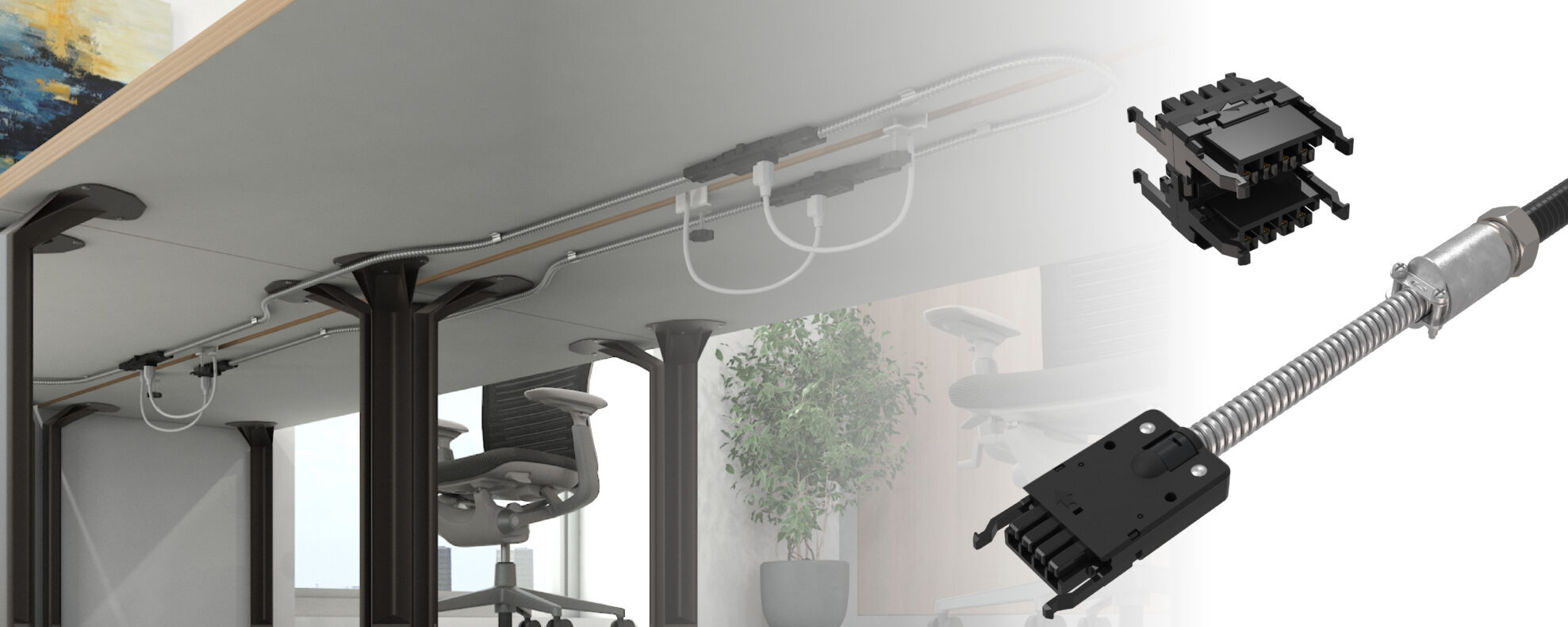 Under-desk cable management with metal conduits and white cables running along the desk underside; office chairs visible in background.